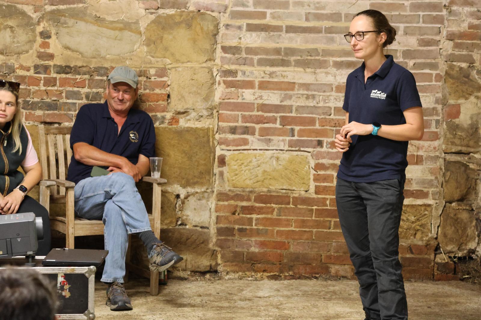 A Fairfield House vet speaking to Beef and Flock Club members in the barn